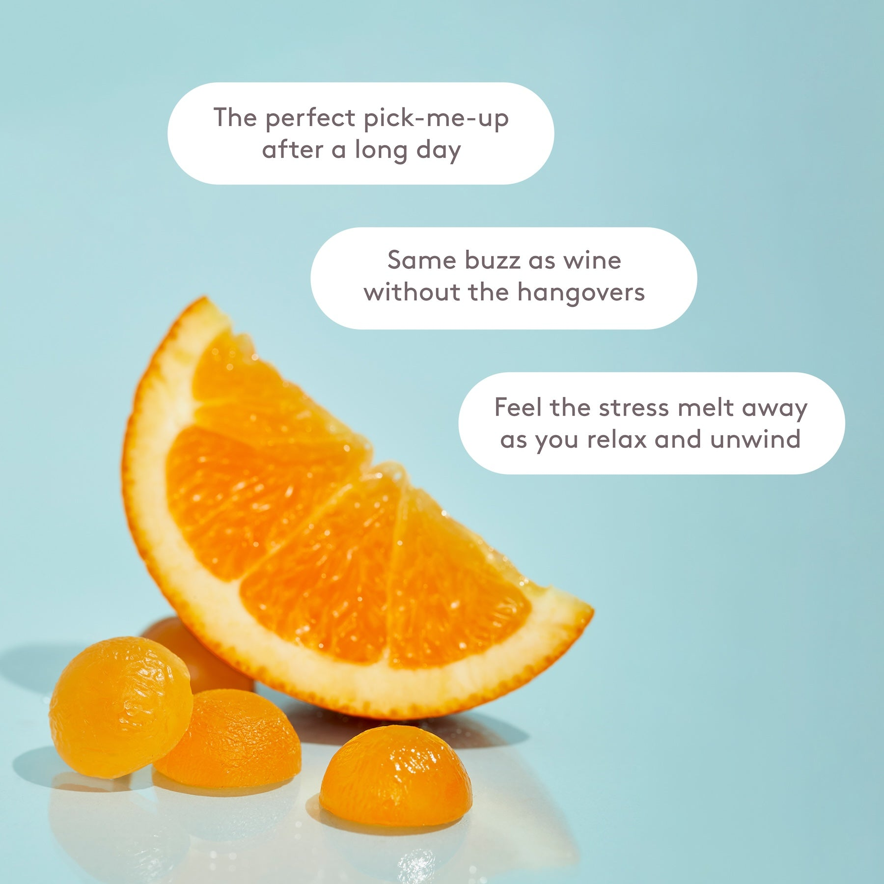 AT2A gummies beside an orange slice